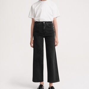 Toteme flare jeans in dark grey/washed out black